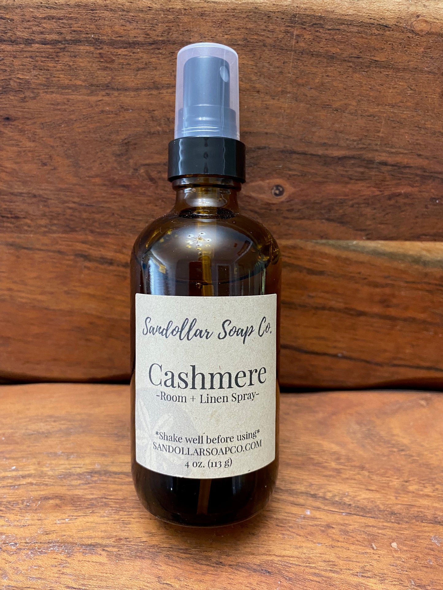 A brown glass spray bottle labeled Cashmere room and linen spray