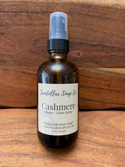 A brown glass spray bottle labeled Cashmere room and linen spray