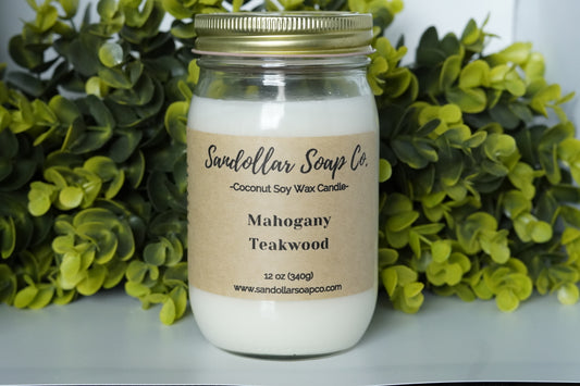 A 12 oz coconut soy wax candle in a mason jar that includes a gold lid. Made with a cotton wick and scented "Mahogany Teakwood." Renamed Mahogany Woods. Notes of cedar and oak intertwine with warm mahogany to create a bold scent loved by men and women alike.