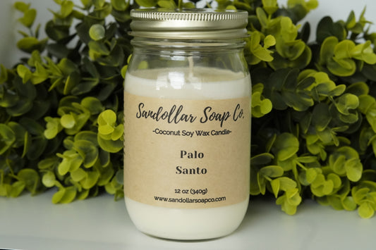 A 12 oz coconut soy wax candle in a mason jar that includes a gold lid. Made with a cotton wick and scented "Palo Santo." Aromatic patchouli has a distinctive, warm, and earthy aroma