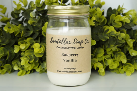 A 12 oz coconut soy wax candle in a mason jar that includes a gold lid. Made with a cotton wick and scented "Raspberry Vanilla." Light and sweet blend of bergamot, pear, plum wine, vanilla, orchid, cashmere, and musk.