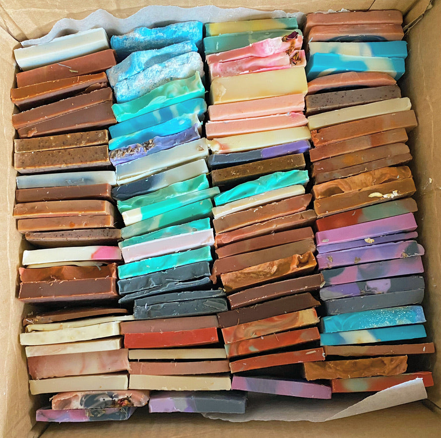 box containing slices of soap ends in various colors